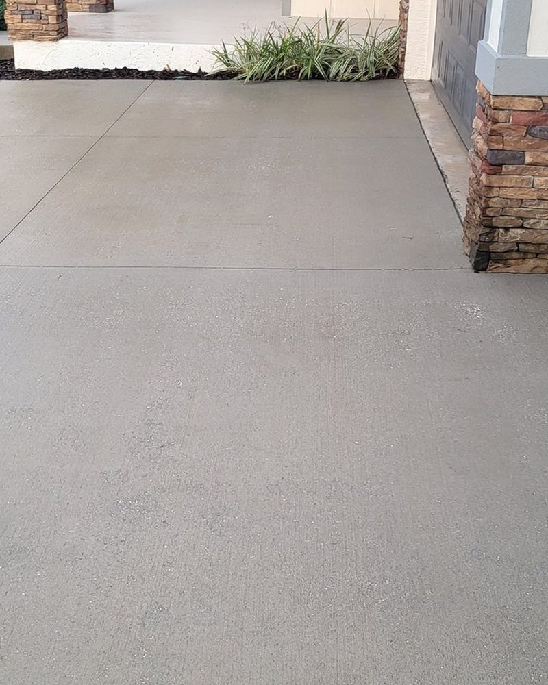 Walkway and garage apron after cleaning by H&S Home Services