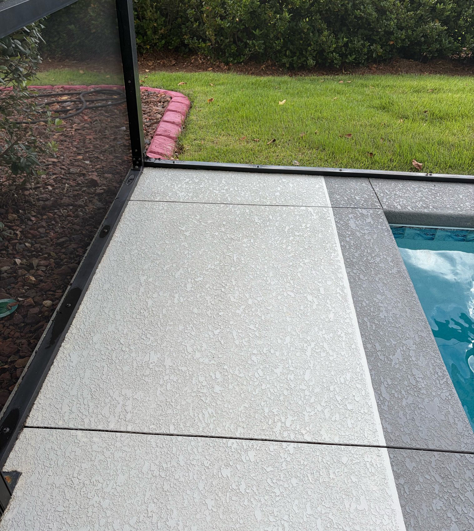 Cool deck after cleaning — close-up of clean textured pool deck