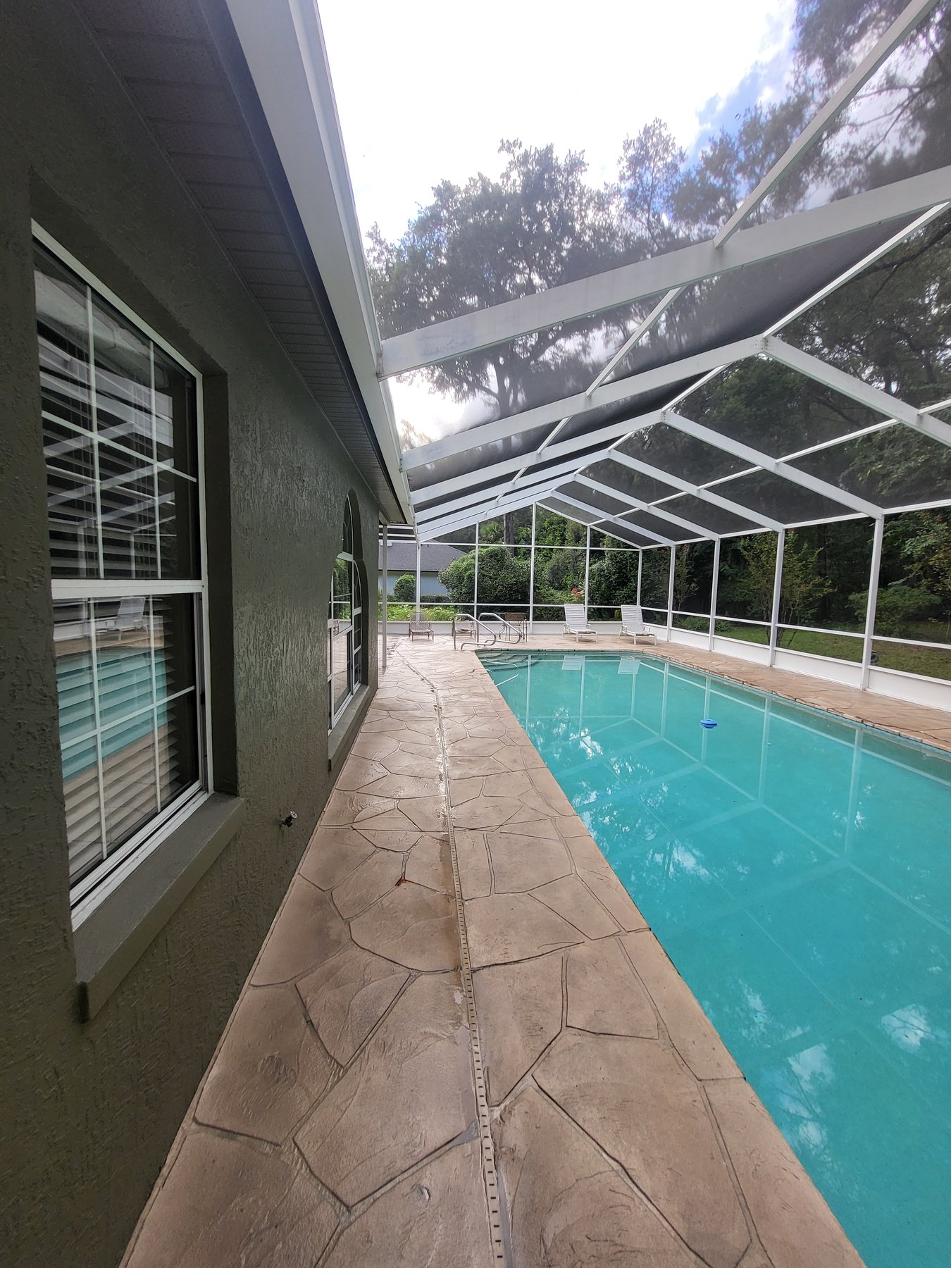 Stamped pool deck after cleaning — bright textured concrete